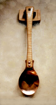 A curly maple and copper spoon